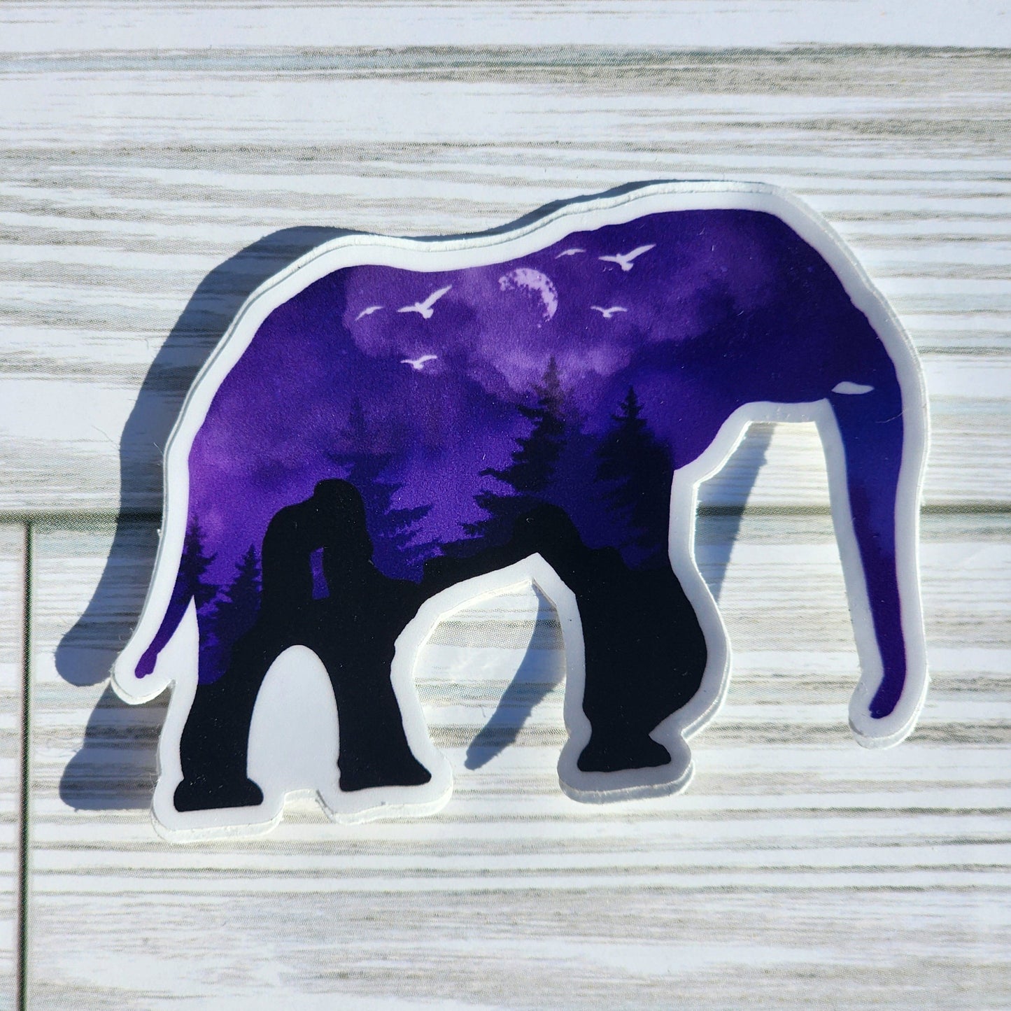 Purple Nighttime landscape within the silhouette of an elephant – shadows of red rocks, moon, and birds form the natural coloring of the design.