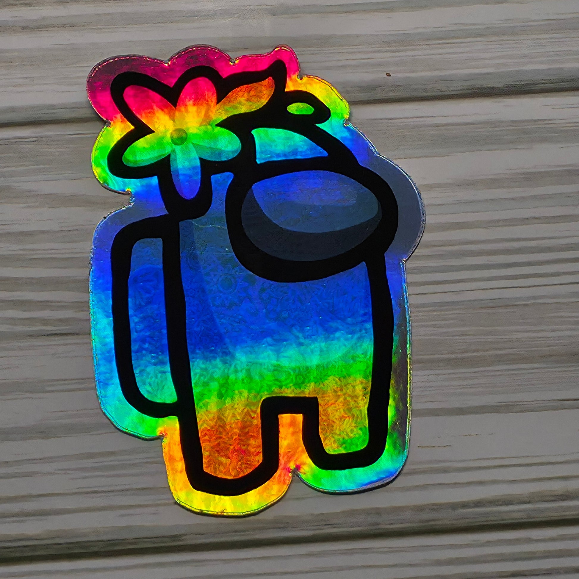 Holographic Among Us crewmate character sticker with rainbow shimmer effect