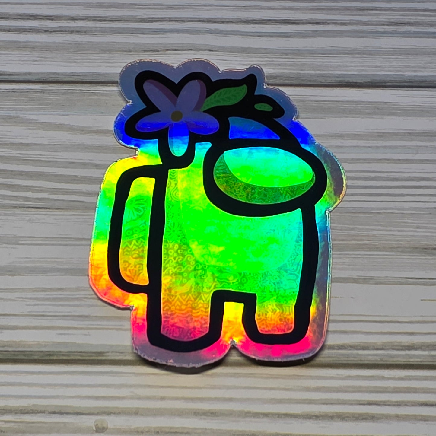 Holographic Among Us crewmate character sticker with rainbow shimmer effect 