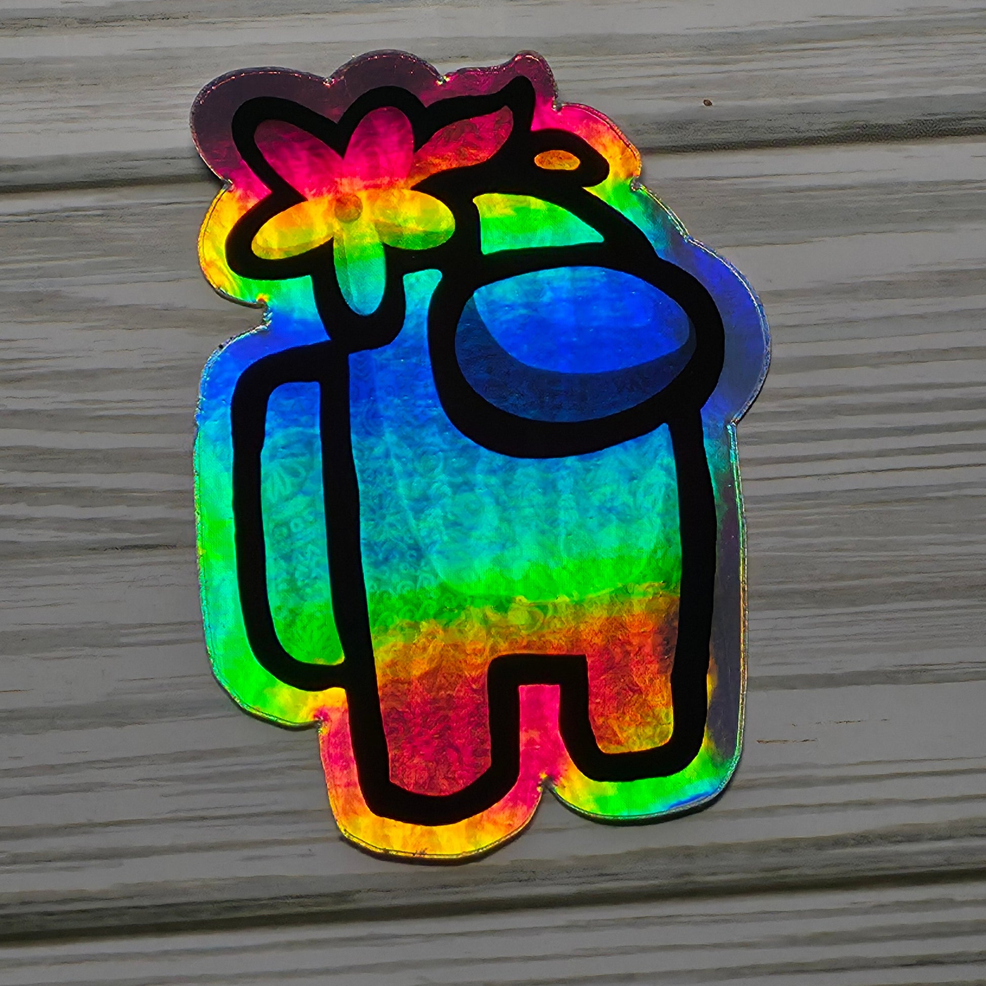 Holographic Among Us crewmate character sticker with rainbow shimmer effect