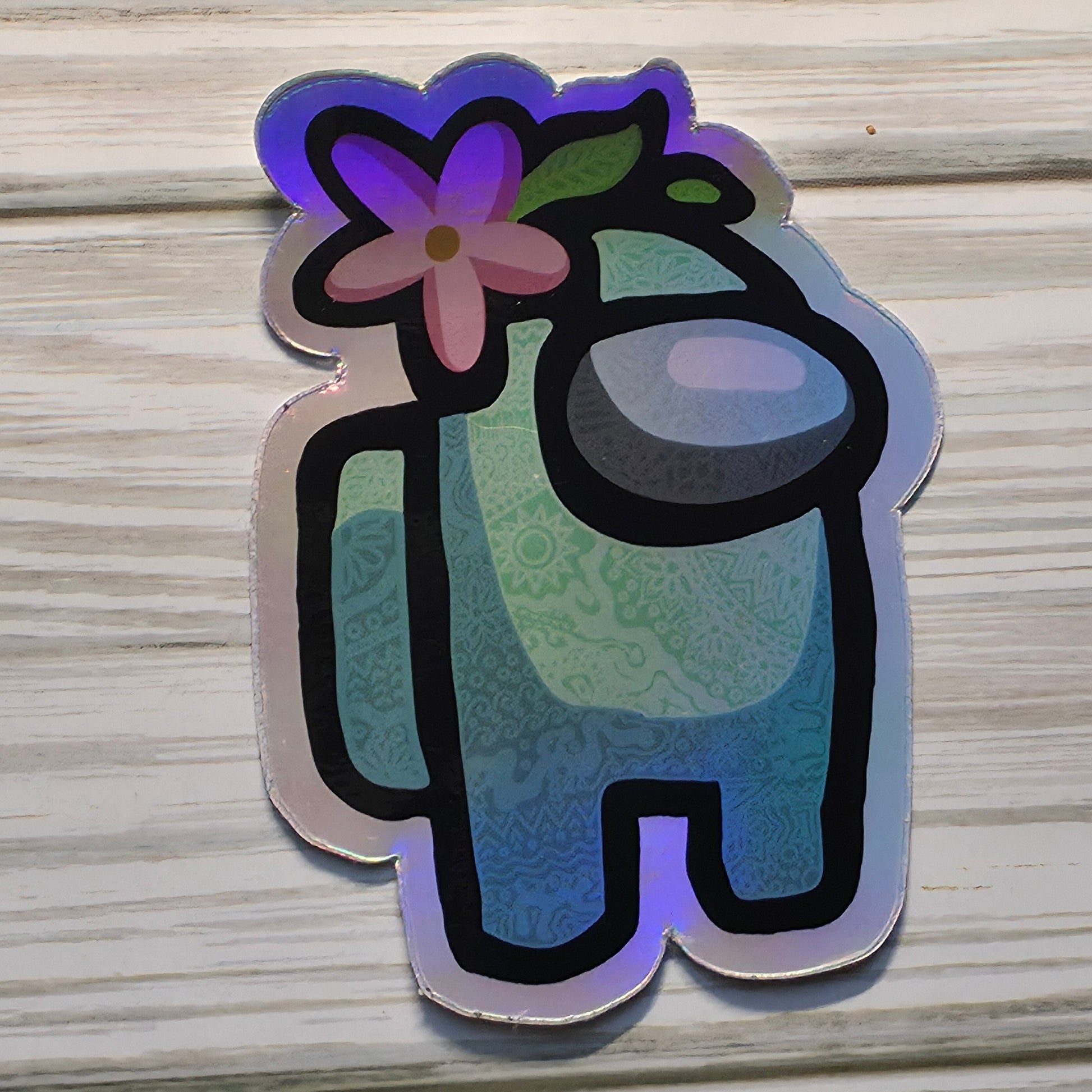 Holographic Among Us crewmate character sticker with rainbow shimmer effect