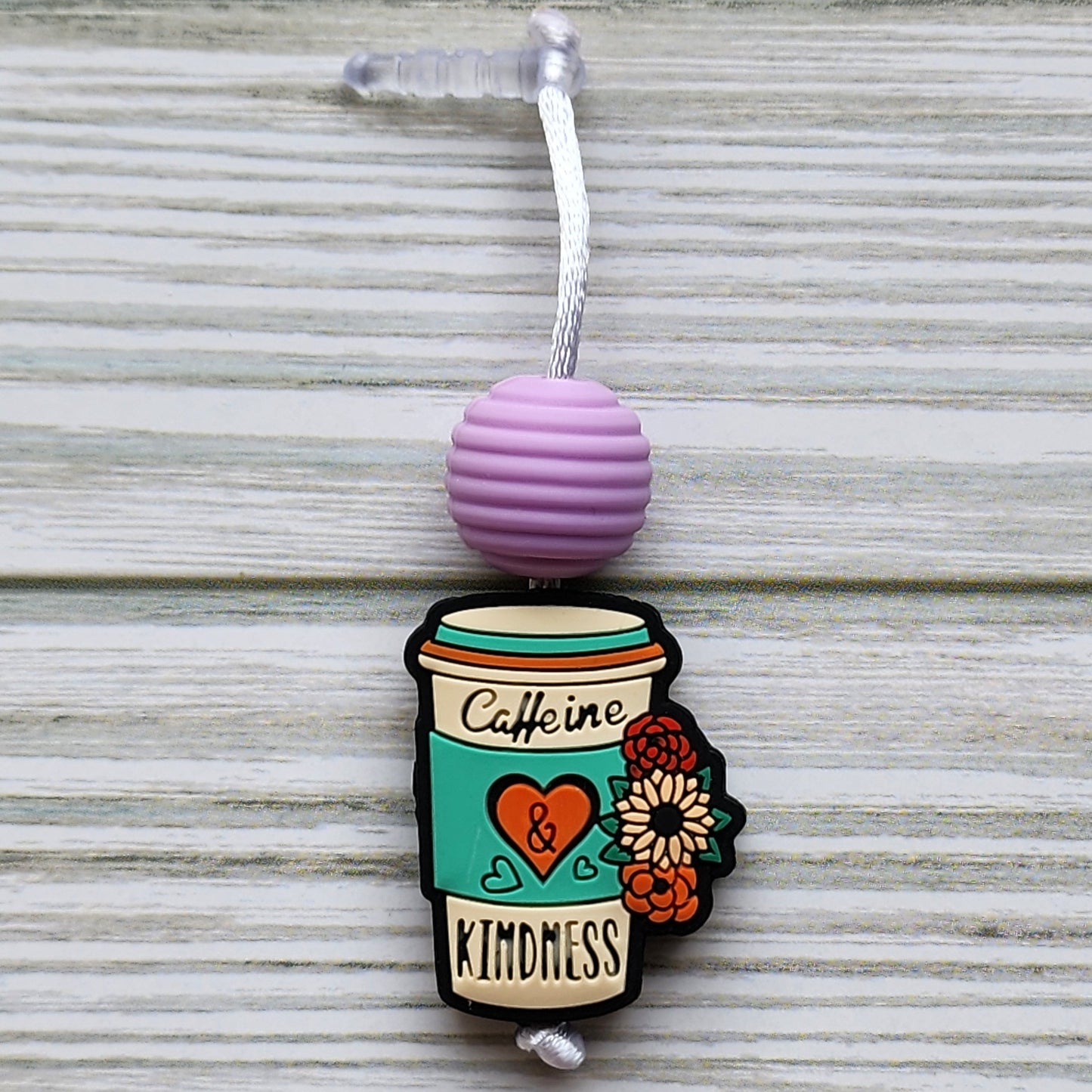 Handmade silicone Nintendo Switch charms in various colors and shapes, attached with white silky cords – designed to add charm without scratching the console.