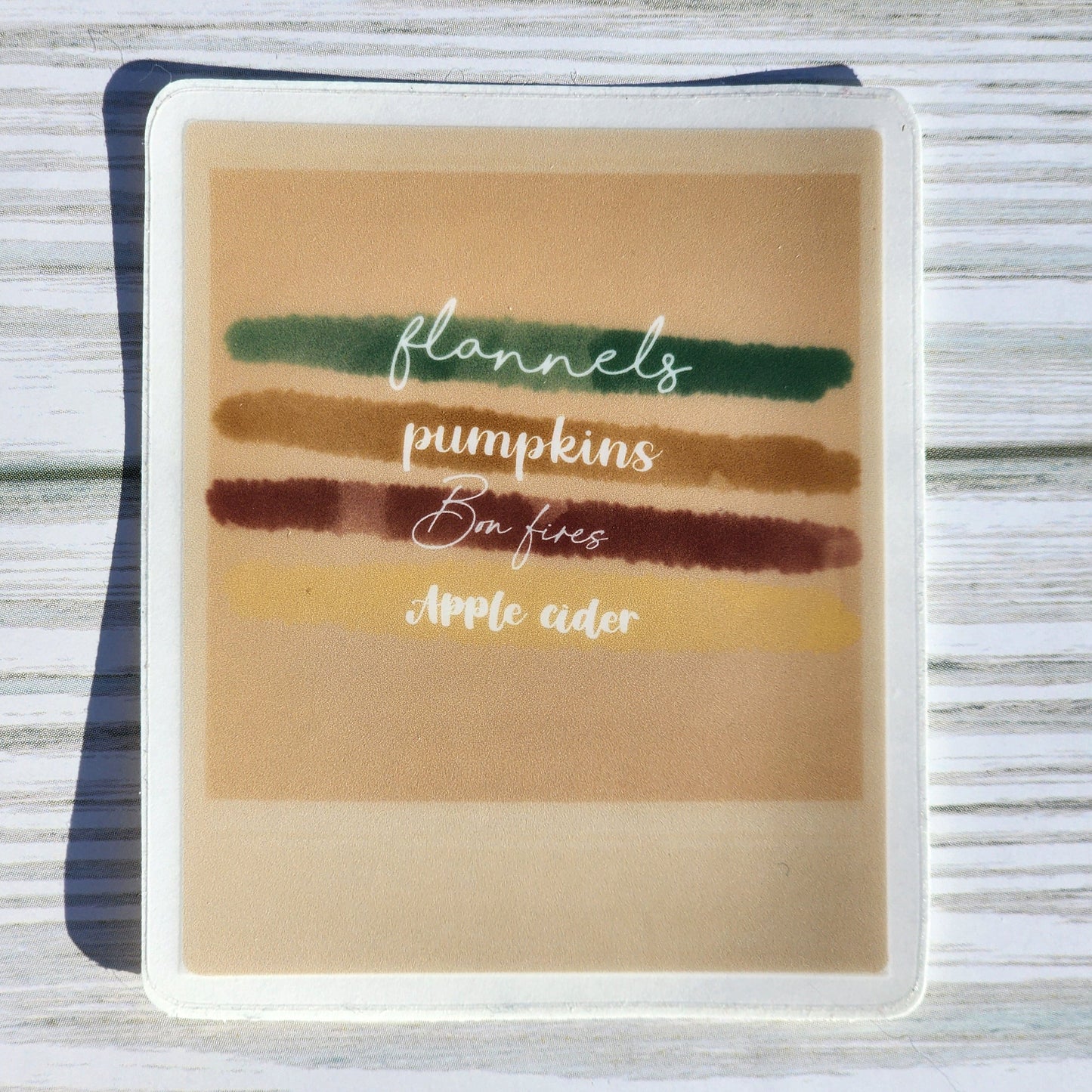 Cute autumn aesthetic waterproof sticker in Polaroid style with cozy fall checklist: Flannels, Pumpkins, Bonfires, Apple Cider.