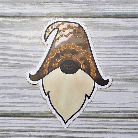Gnome Head with the word Pumpkin spice on his nose, and the hat is decorated with tones of brown and zendoodle designs 