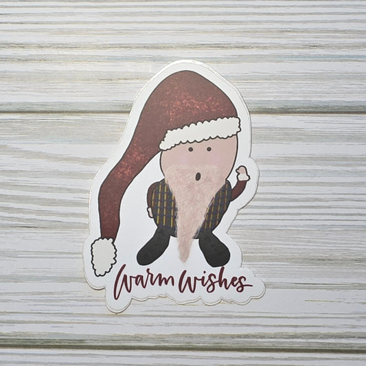 Cute gnome with a scruffy beard wearing a winter hat, standing above the words ‘Warm Wishes.'
