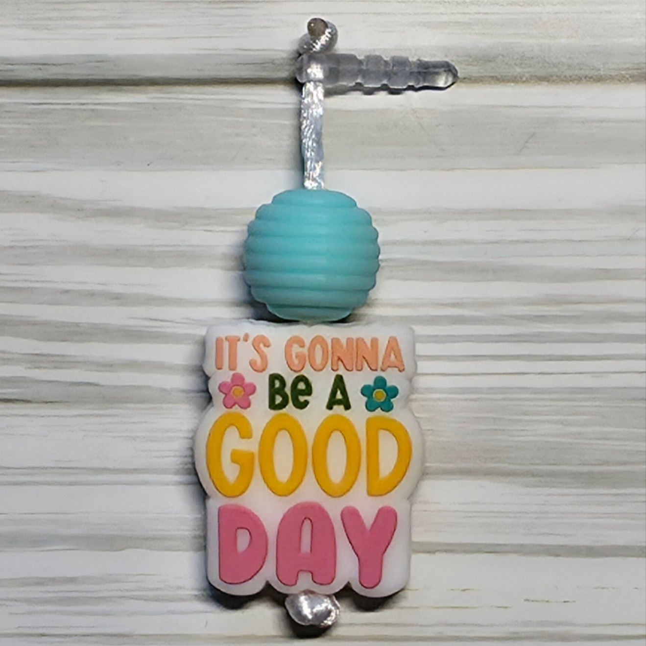 Handmade silicone Nintendo Switch charms in various colors and shapes, attached with white silky cords – designed to add charm without scratching the console.