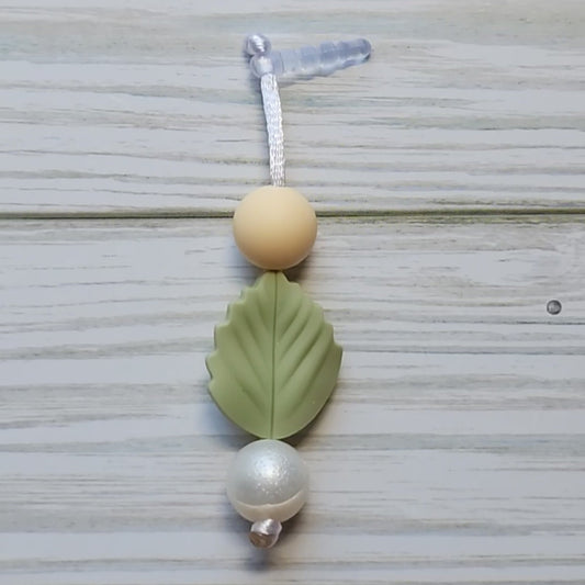 Handmade silicone Nintendo Switch charms in various colors and shapes, attached with white silky cords – designed to add charm without scratching the console.